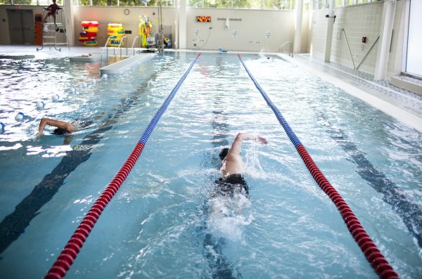 student swimming at UIC recreation center's swimming pool