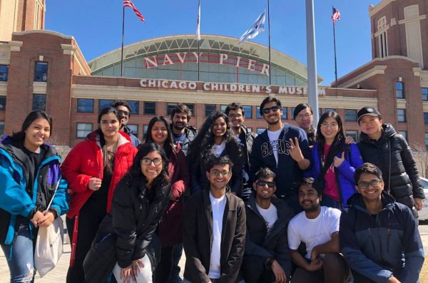 International students posing in front of Chicago children's museum at navy pier