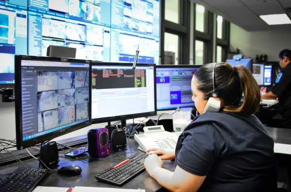an emergency call taker and working with multiple monitors and talking on the phone