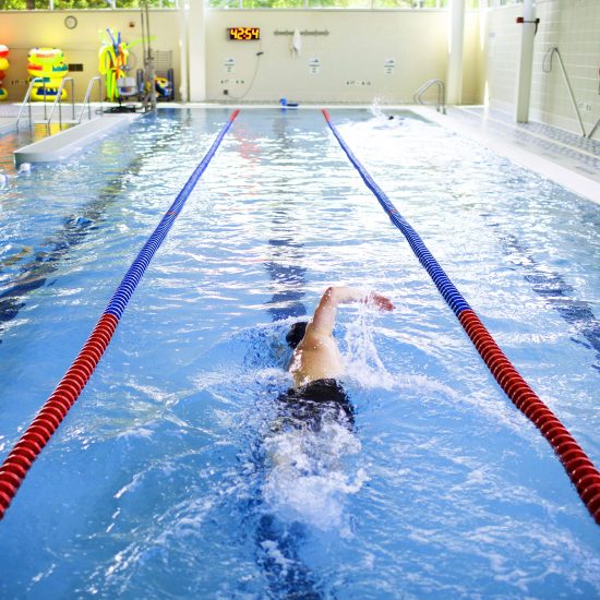 student swimming at UIC recreation center's swimming pool