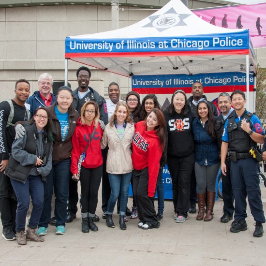 UIC students posing with UIC police and security staff