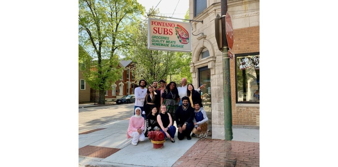 Students pose in a group outside an Italian deli on near the UIC campus.